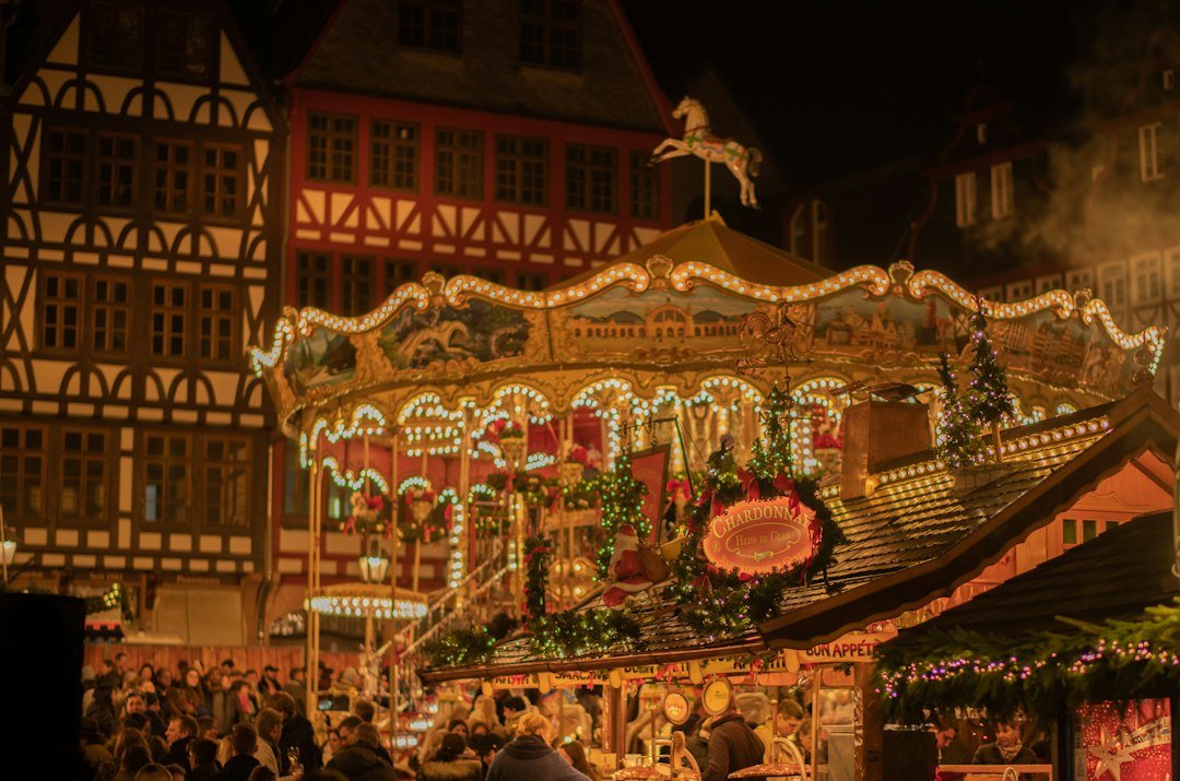 A traditional Christmas market in Germany with wooden stalls and lights